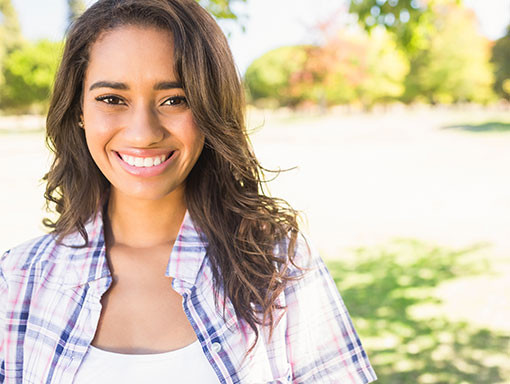 young woman with white teeth smiling