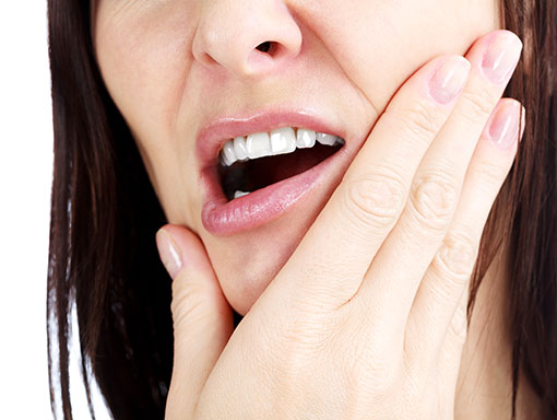 dentist holding a tooth